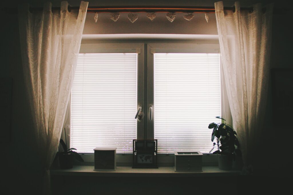 brown-curtain-near-white-2-pane-window