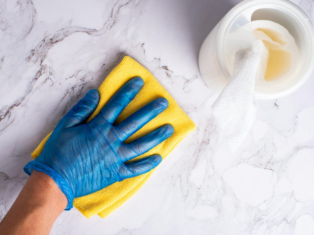man-cleaning-a-counter-top