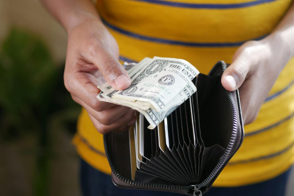 a-person-getting-money-in-the-wallet