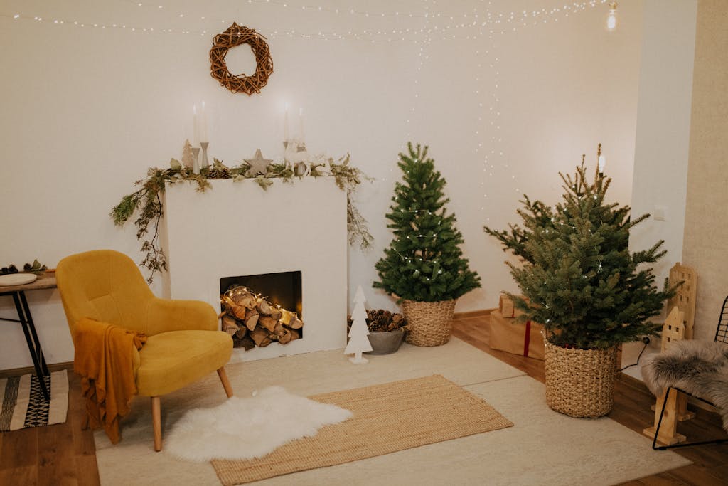 Warm and inviting living room with Christmas decorations, featuring a fireplace and festive decor.