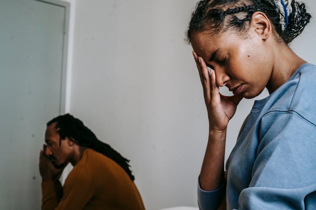 Young black couple pastime with sad face and thinking in casual clothes in daytime