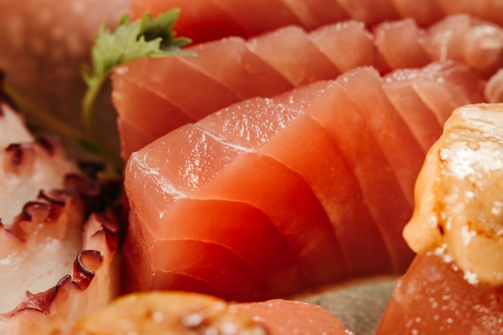 Appetizing close-up image showcasing a variety of fresh sushi and sashimi with vibrant colors and textures.