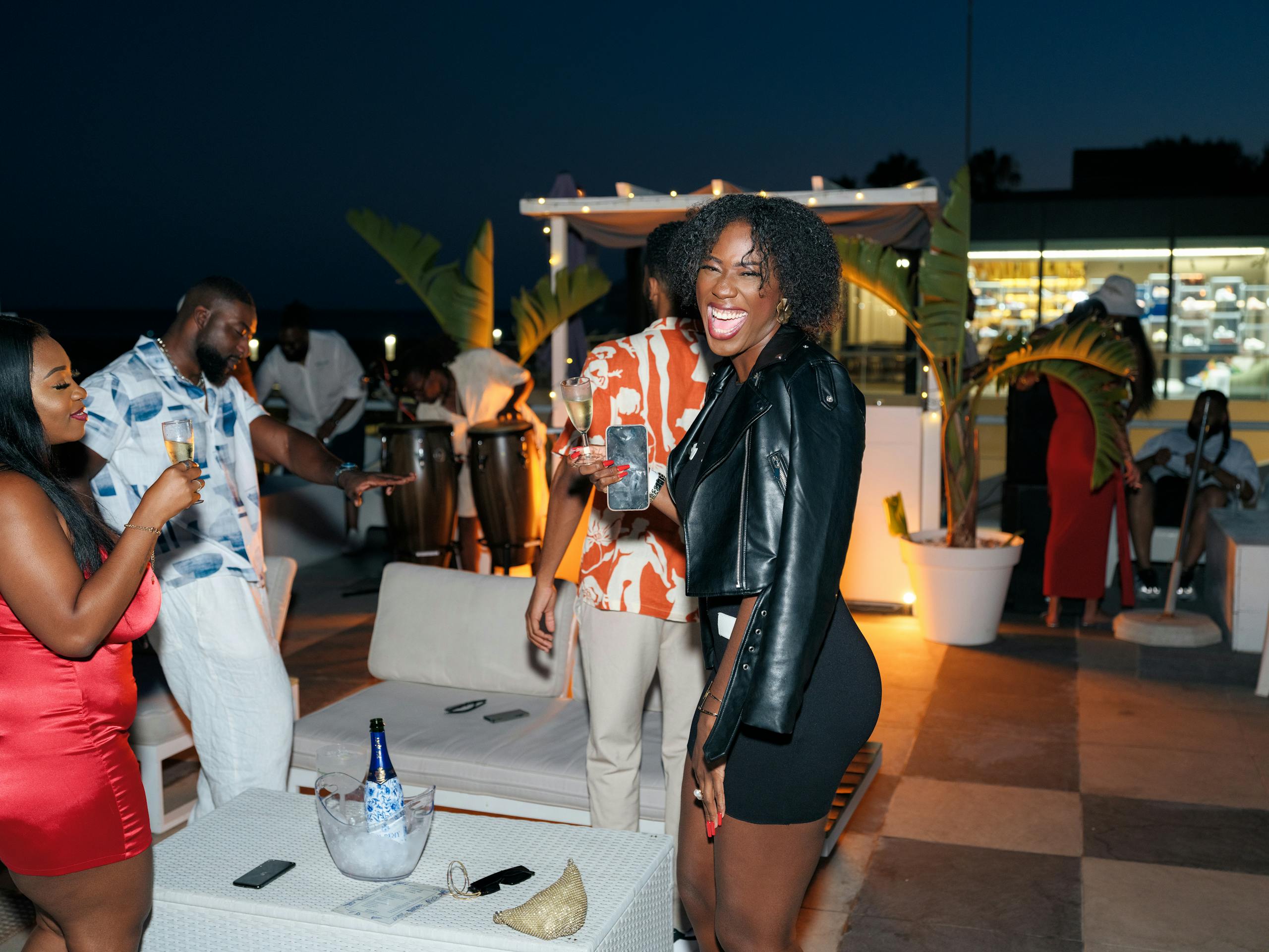 Lively gathering at night with friends celebrating outdoors in Lisbon, Portugal.