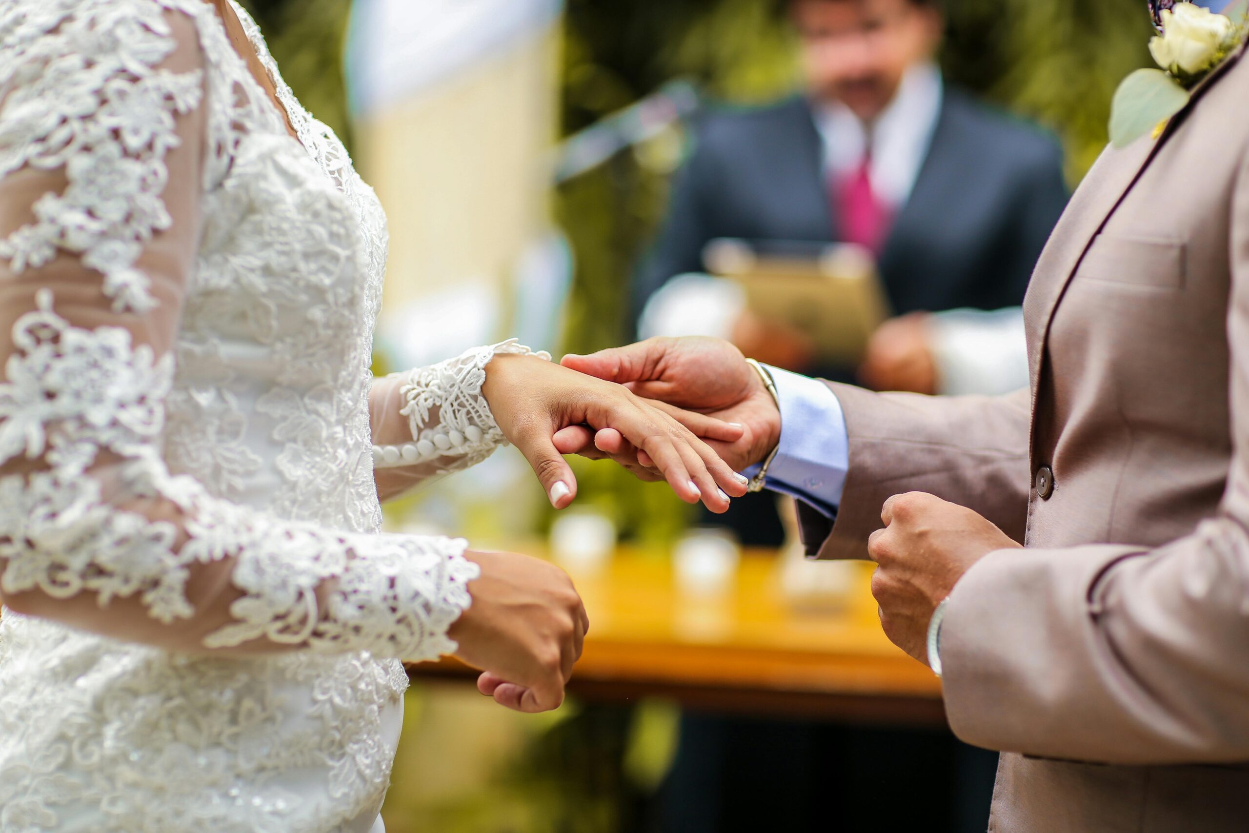 a-groom-holding-the-hand-of-the-bride