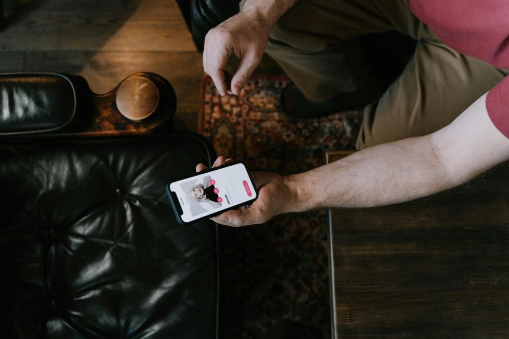 person-holding-a-smartphone-with-dating-matching-app-on-screen
