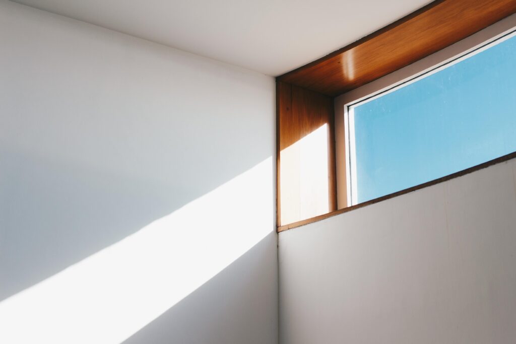 clear-glass-window-with-brown-and-white-wooden-frame