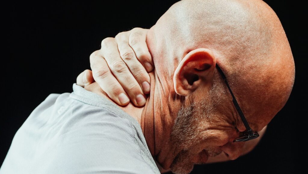 close-up-photo-of-a-man-having-a-neck-pain
