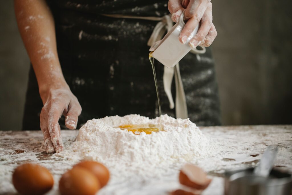 chef-preparing-dough-for-cooking-in-kitchen