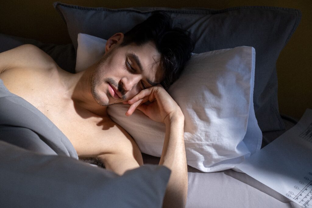 man-bed-bedroom-portrait