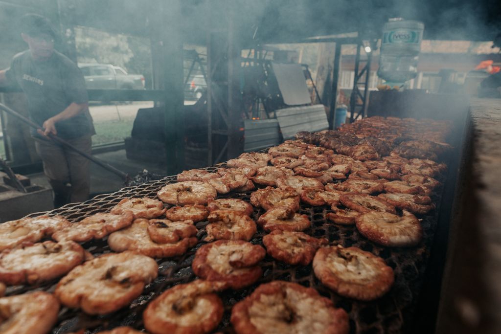 Sizzling Argentine meats being grilled to perfection over an open flame, capturing the essence of asado culture.