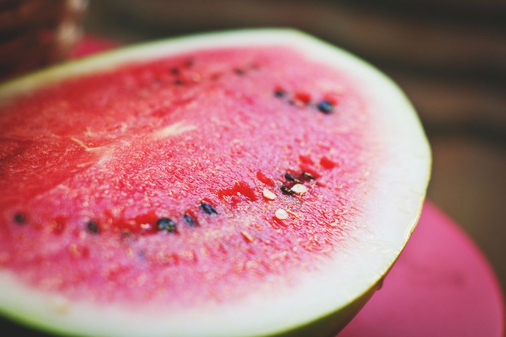Vibrant close-up of a fresh, juicy watermelon slice highlighting seeds and texture.