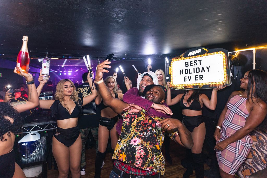 Vibrant nightclub party with people celebrating, dancing, and enjoying the night.