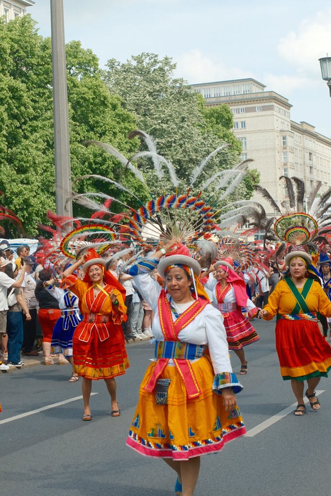 Vibrant traditional dancers in colorful costumes during Berlin's lively street carnival parade.